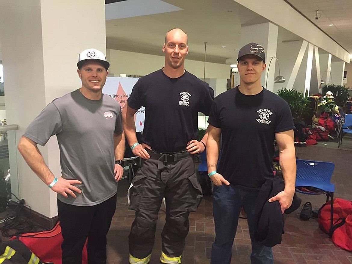 A few members of the Selkirk Fire & Rescue team pause from getting ready for the Scott Firefighter Stairclimb to get their photo taken. The team is holding a fundraiser Saturday at Super 1 Foods in Sandpoint.