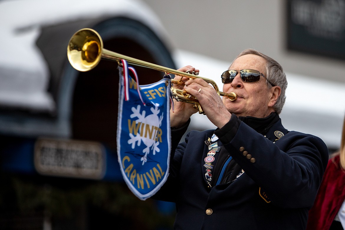 The royalty trumpet player on the Whitefish Winter Carnival float during the parade Saturday afternoon. (JP Edge photo)