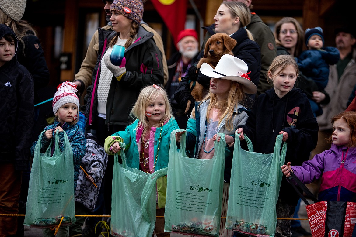 Kids line Central Avenue waiting for candy to be thrown during the Carnival parade. (JP Edge photo)