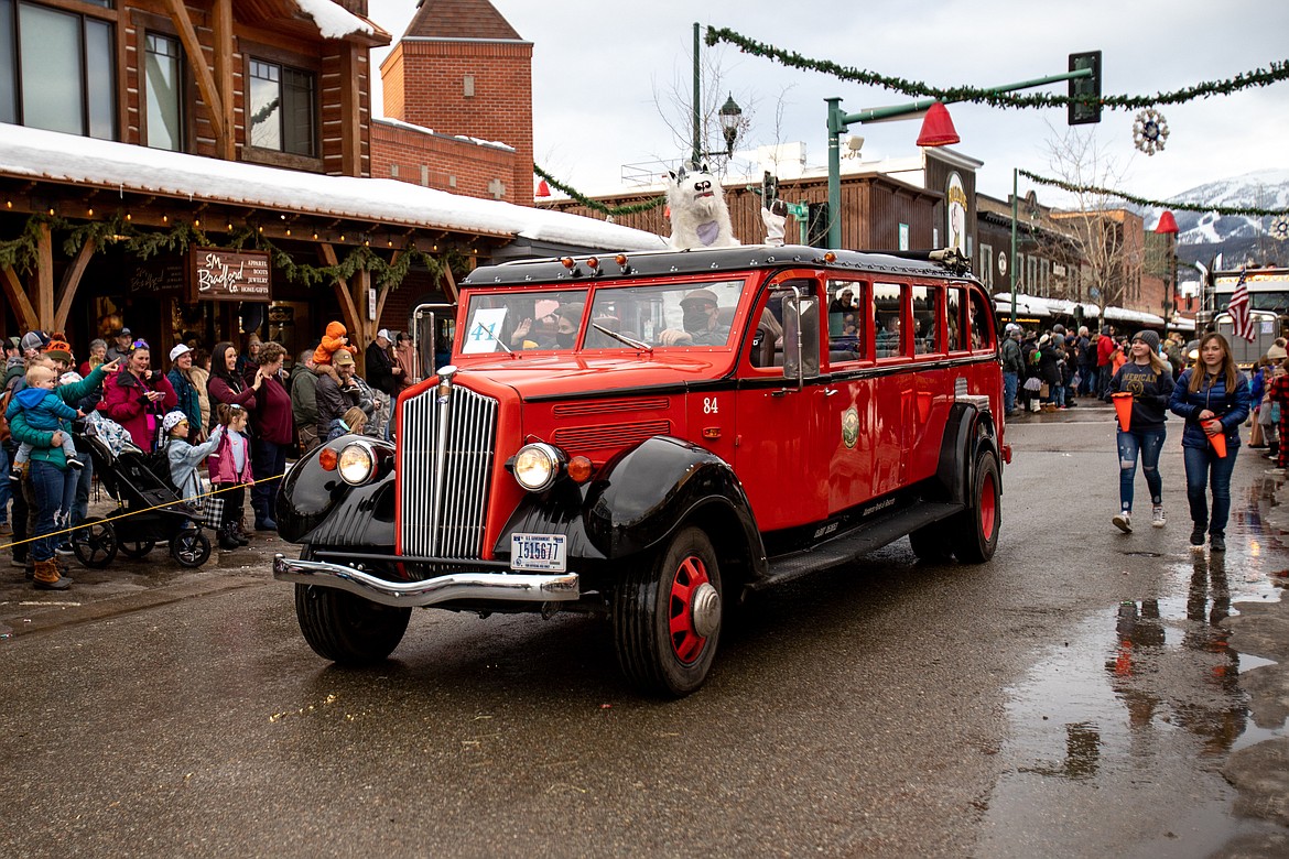 An iconic Glacier red bus in the Whitefish Carnival. (JP Edge photo)