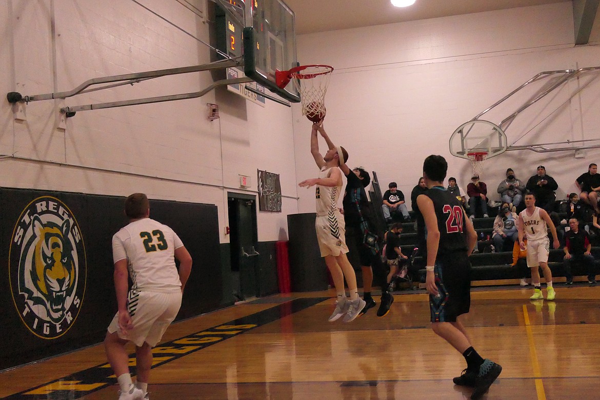 St. Regis' forward Tanner Day goes up for two of his 30 points in the win over the Eagles Thursday in St. Regis.  (Chuck Bandel/VP-MI)