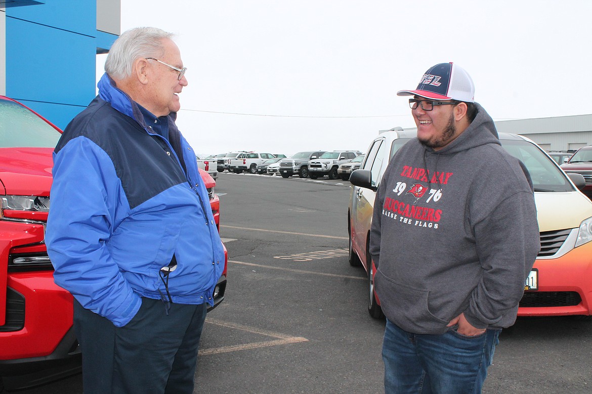 Ray Mayo, left, talks with the relief shuttle driver Darion Valdez at the Bud Clary Toyota of Moses Lake on Friday.