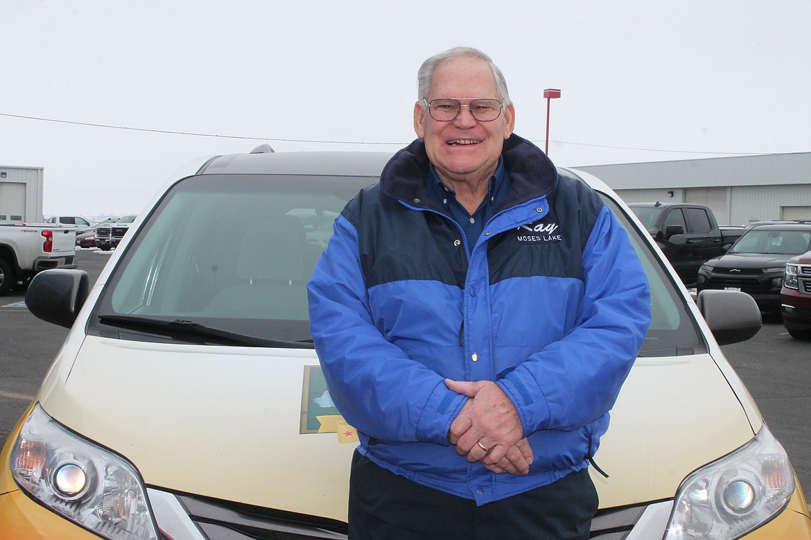 Ray Mayo is pictured with his shuttle van on Friday.