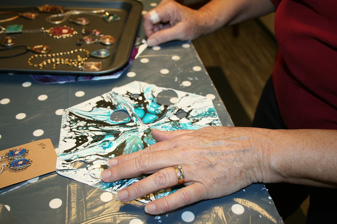 Phyllis PuFahl tests different designs for a piece of jewelry Jan. 26 in her Moses Lake studio.