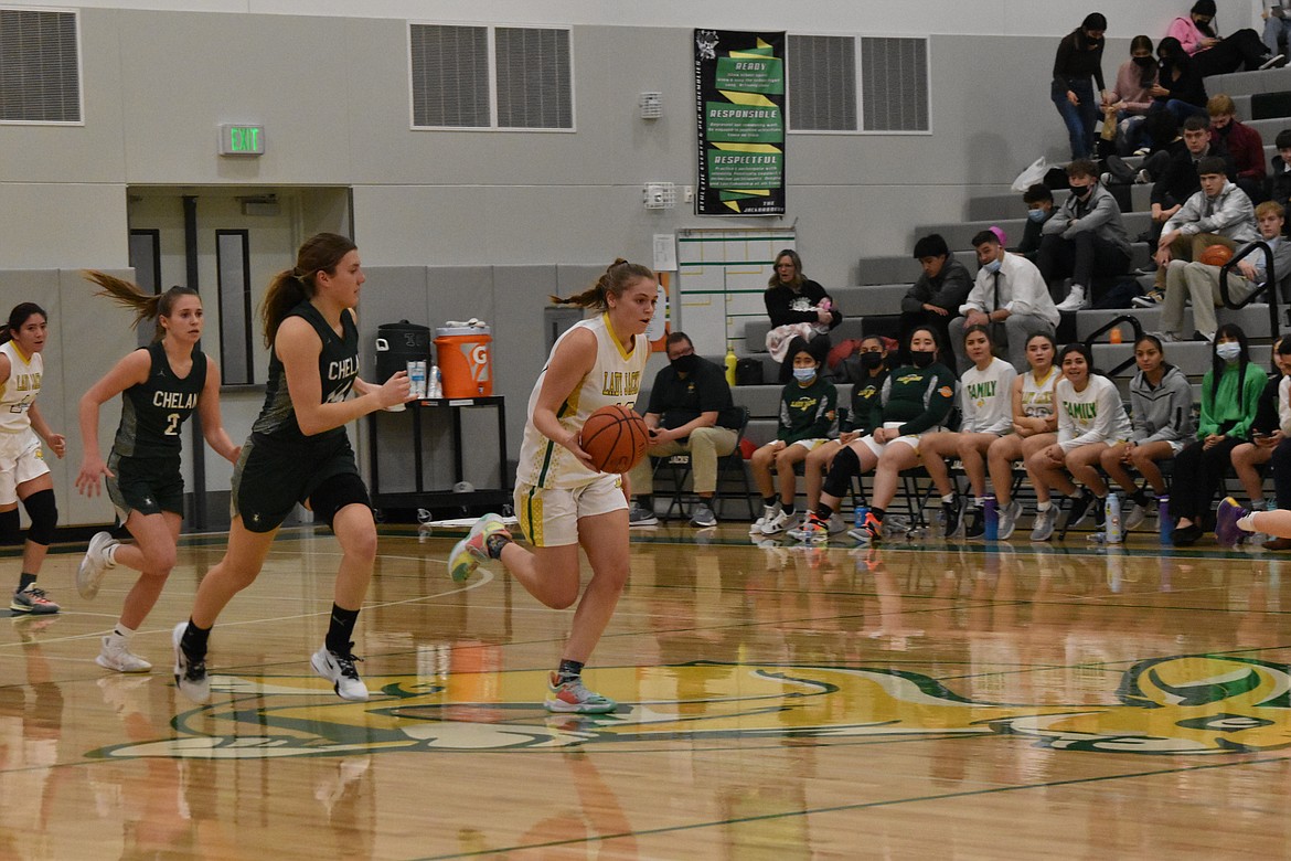 Quincy High School senior Emily Wurl, named Caribou Trail League first team all-league, drives down court to the basket during the game against Chelan High School on Jan. 25.