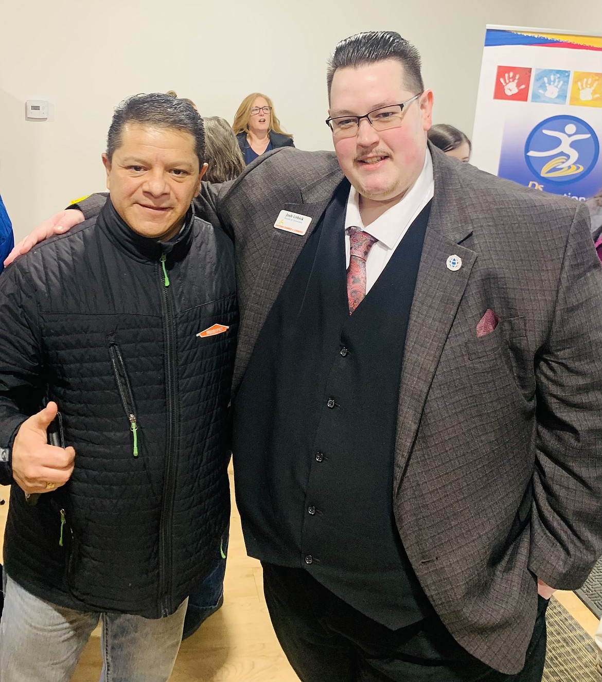 Israel Herrera with ServPro of Coeur d'Alene (left) and Josh Urbick with Global Credit Union at The Village Bakery grand opening and ribbon cutting.