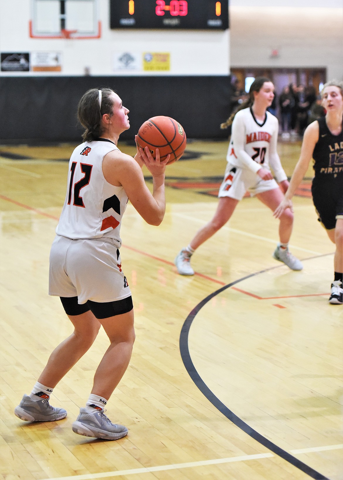 Ronan's Olivia Heiner takes a 3-pointer against Polson. (Scot Heisel/Lake County Leader)