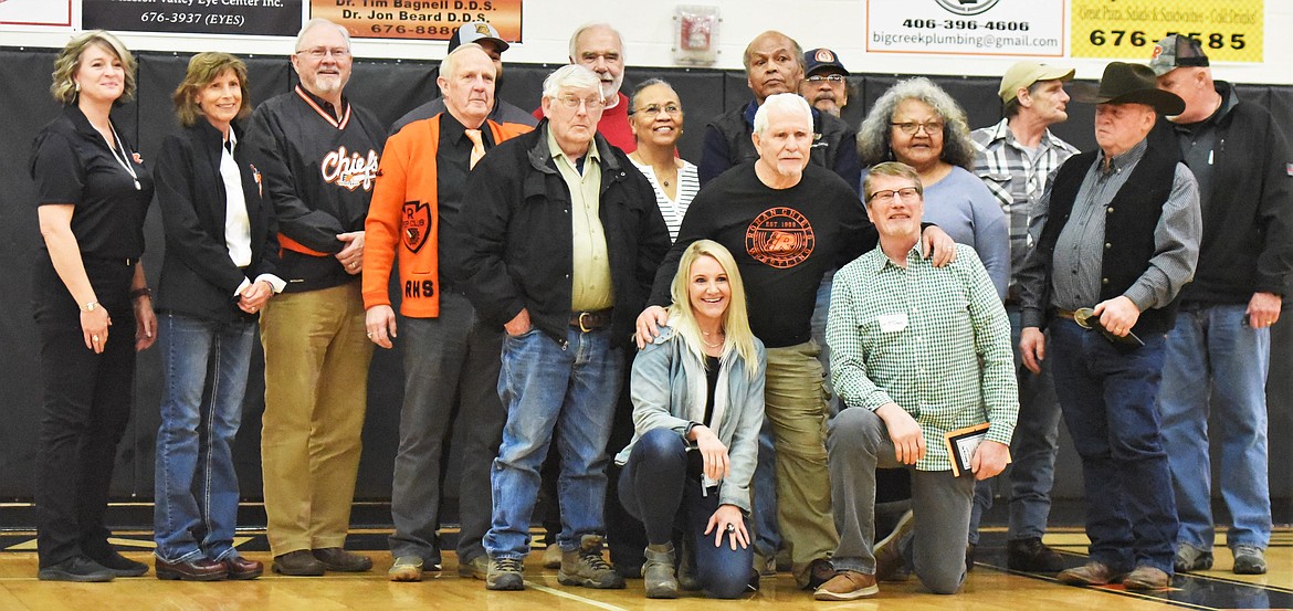 Ronan honored the inaugural class in the Ronan High School Hall of Fame on Friday. Inductees and representatives posed for a photo before the boys' game against Polson. Those honored included Laverne Parrish, Marvin Camel, Jim Darlington, Jana (Smith) Streitz, David Edington, the 1976 state champion wrestling team, the 1960 state champion boys basketball team, and Dorothy and Keith Lundvall. (Scot Heisel/Lake County Leader)