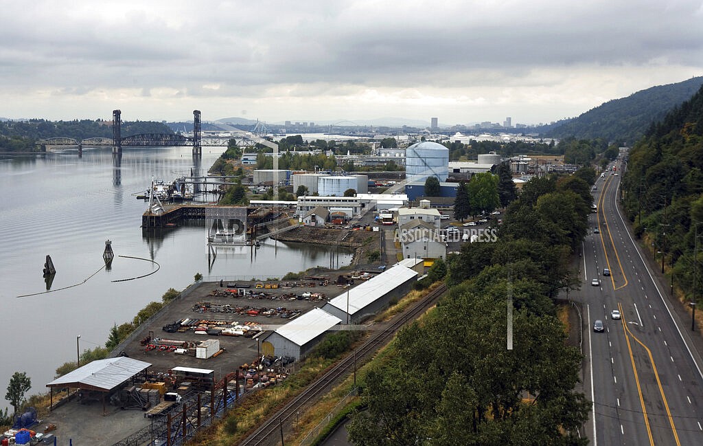 The Critical Energy Infrastructure Hub, which lies along a 6-mile (10-kilometer) stretch of the Willamette River in Portland, Ore., is seen on Aug. 23, 2013. Scientists say Oregon faces a potential nightmare scenario unless work is done to fortify the hub, where more than 90% of the state’s liquid fuels are stored, against a major earthquake, which will come sooner or later. This week, Oregon lawmakers began taking steps to compel the owners and operators of the facility’s aging storage tanks to make them earthquake resilient. (Mike Zacchino/The Oregonian via AP)