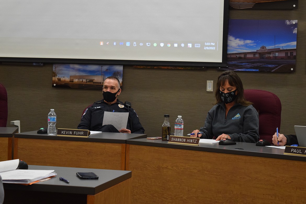 Moses Lake School Board Chair Kevin Fuhr and co-chair Shannon Hintz listen to a presentation from Northwest Leadership Associates representatives regarding the interview process which is expected to lead to the hiring of a new superintendent for the district.