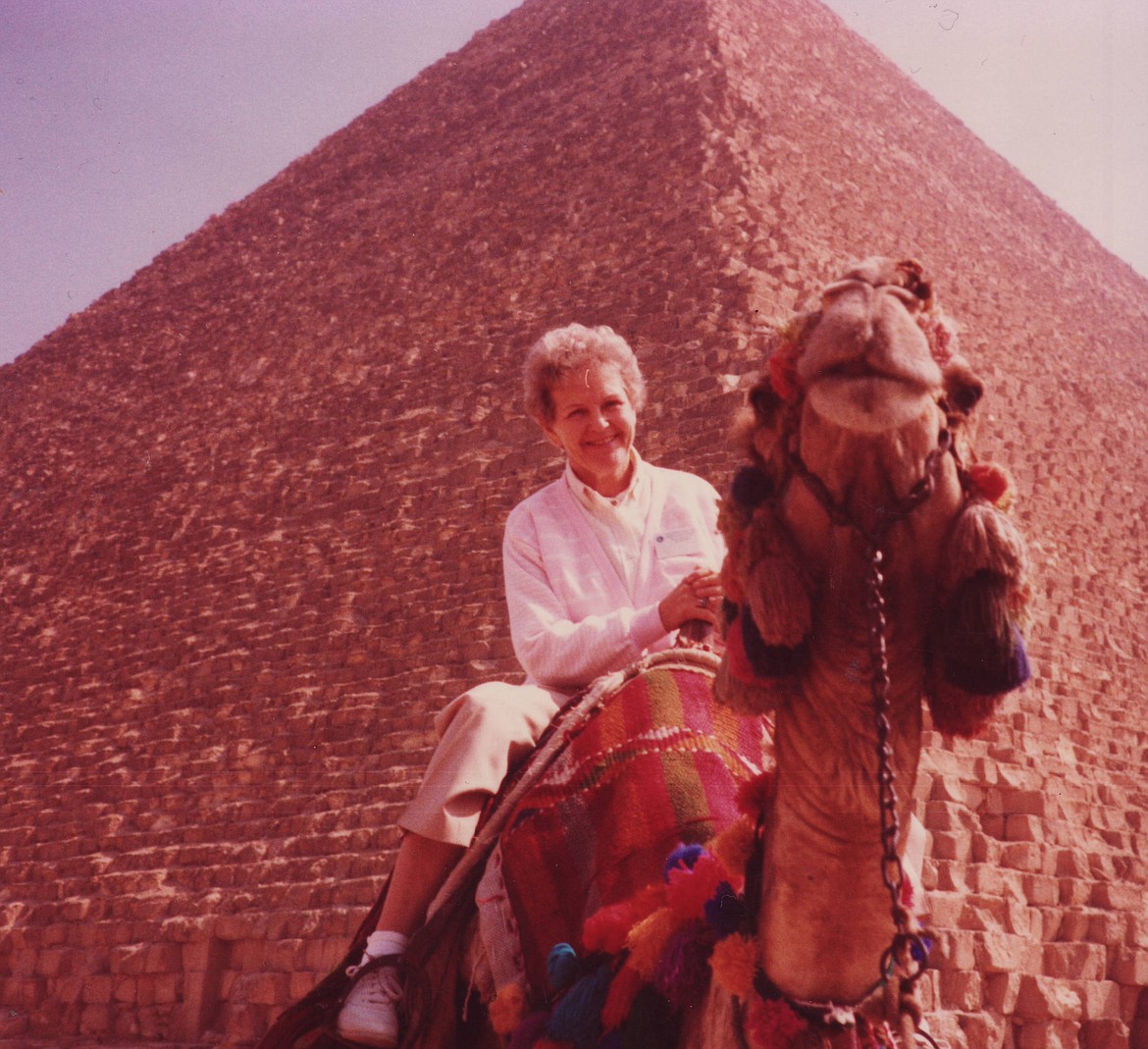 Delight Morrison Leas rides a camel in the shadow of the Great Pyramid of Giza in a 1980s photo.