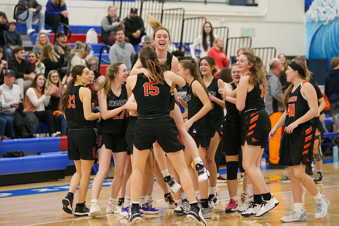 JASON DUCHOW PHOTOGRAPHY
Post Falls celebrates after beating Coeur d'Alene on Thursday night in the 5A Region 1 girls basketball second-place game at Coeur d'Alene. Post Falls advances to a state play-in game on Saturday in Grangeville vs. Owyhee of Meridian.