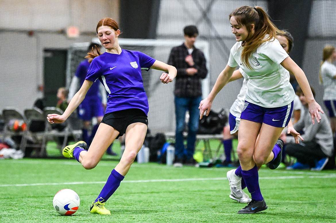 NSC 05/06G Purple's Allison Pollan (10) sends a shot on goal against NSC 05/06G White at the Montana Indoor Soccer Championship tournament at the Flathead County Fairgrounds Trade Center building on Friday, Feb. 11. (Casey Kreider/Daily Inter Lake)