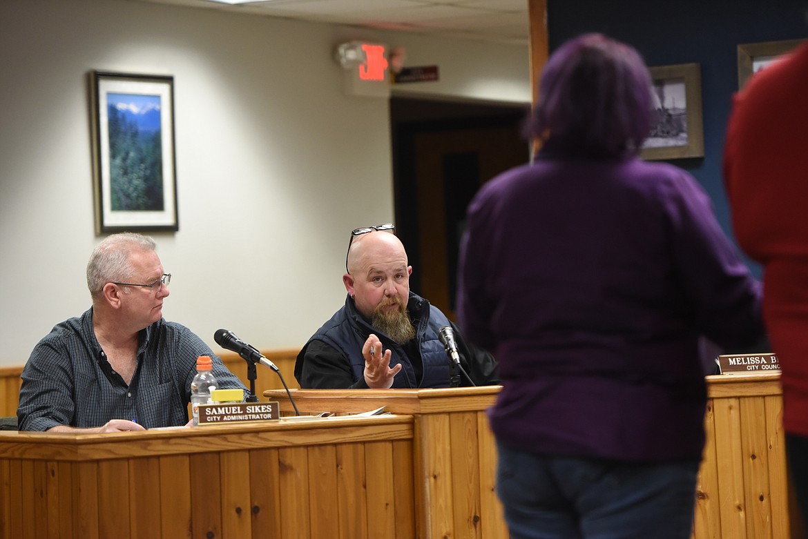 City Councilor Gary Beach speaks with Faith Lee and Jeff Sharp of Kootenai Pets for Life during a Feb. 7 meeting. The nonprofit hopes to expand its facility on city-owned land. (Derrick Perkins/The Western News)