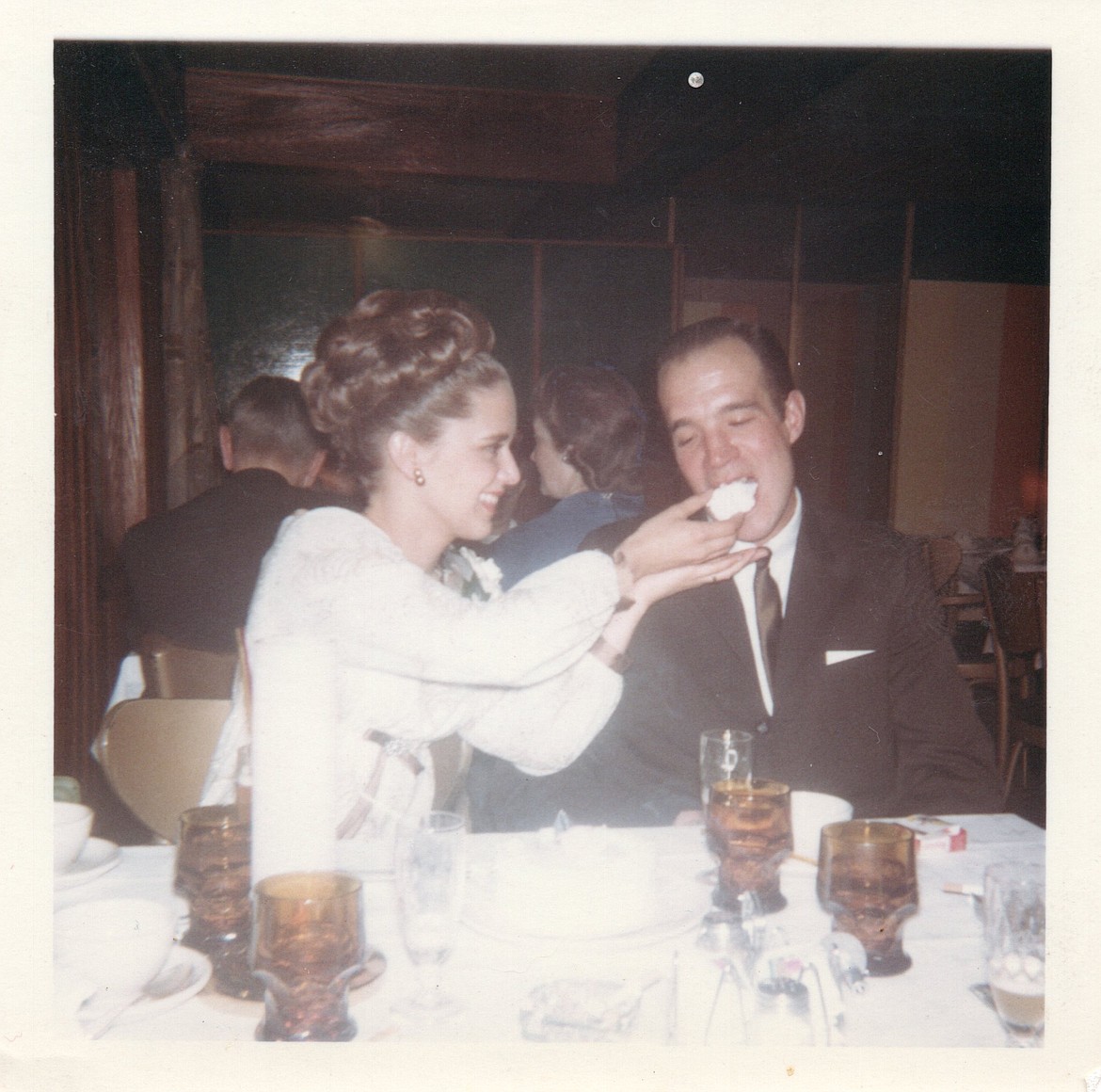 Newlyweds Chuck and Linda Smith, enjoying their wedding cake at Cedars Floating Restaurant on Nov. 7, 1964.