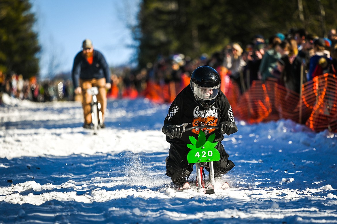 Participants race down Sugar Hill during the Barstool Ski Races at the 43rd annual Cabin Fever Days in Martin City on Saturday, Feb. 12. (Casey Kreider/Daily Inter Lake)
