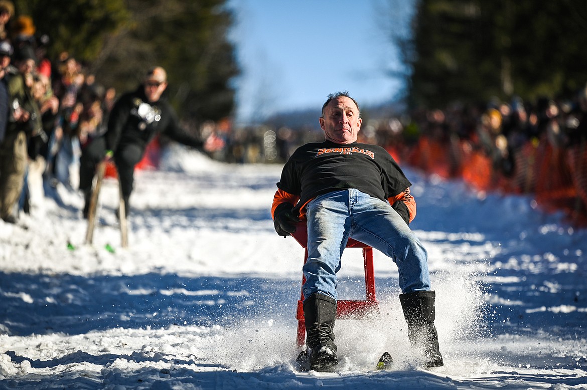 Mike Murray hits the brakes as he nears the finish line during the Barstool Ski Races at the 43rd annual Cabin Fever Days in Martin City on Saturday, Feb. 12. (Casey Kreider/Daily Inter Lake)