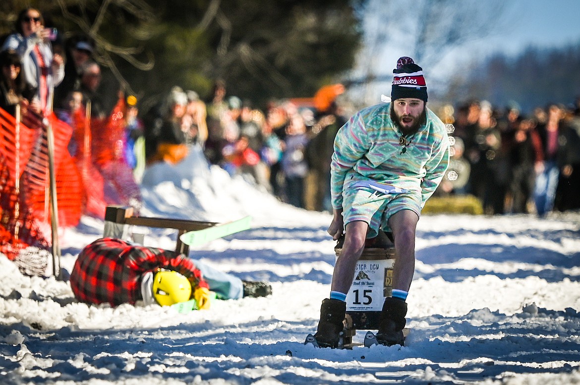 Participants race down Sugar Hill during the Barstool Ski Races at the 43rd annual Cabin Fever Days in Martin City on Saturday, Feb. 12. (Casey Kreider/Daily Inter Lake)