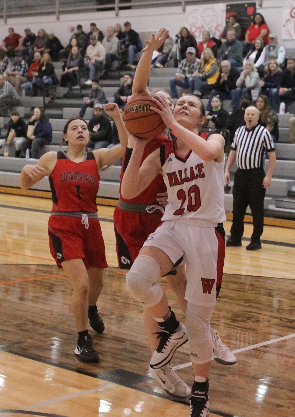 MARK NELKE/Press
Jaden House (20) of Wallace drives the basket against Clearwater Valley in the first half of a state 1A Division I girls basketball play-in game Saturday at Post Falls High.