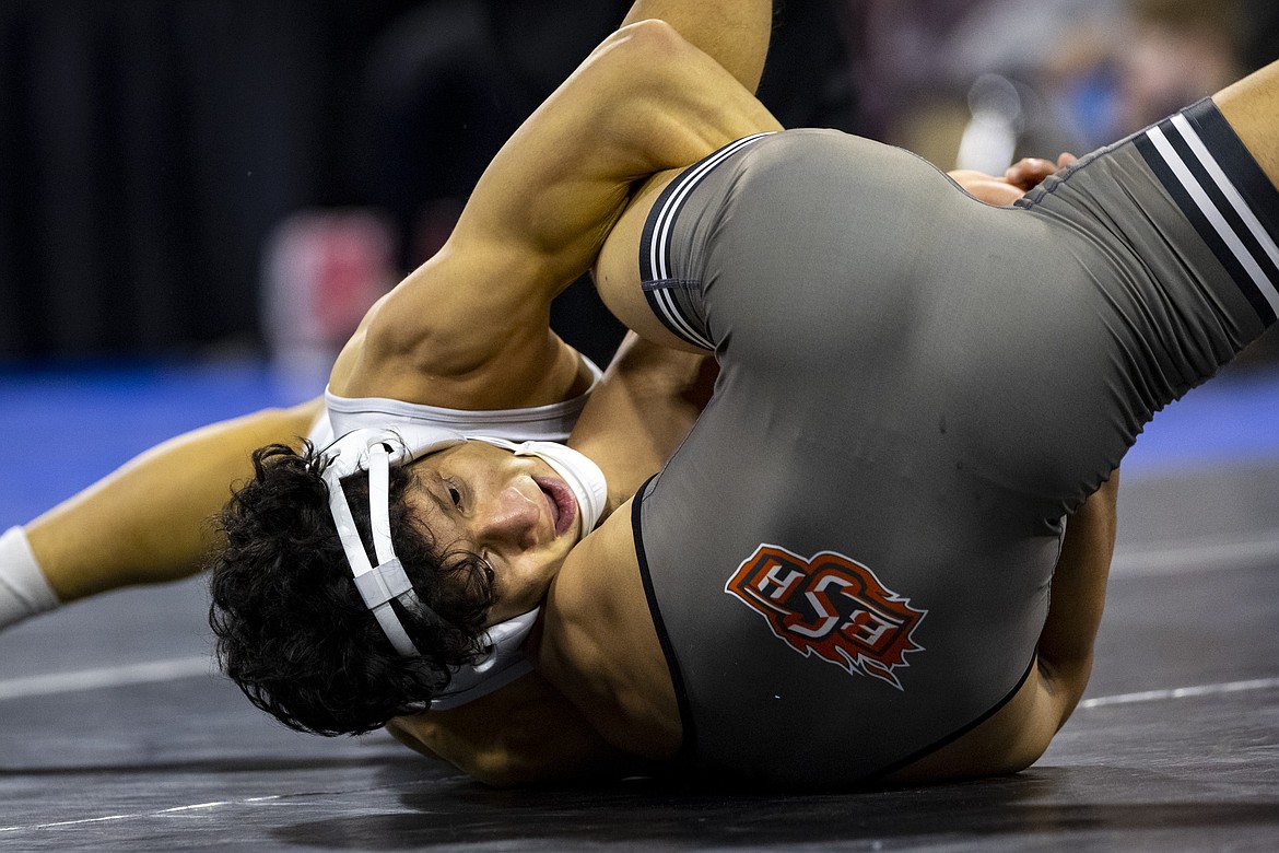 Glacier's Teegan Vasquez, facing, wrestles Billings Senior's Idren Peak in the 132 pound Class AA final during the MHSA State Wrestling tournament at First Interstate Arena in Billings on Saturday, Feb. 12. (Mike Clark/Billings Gazette)