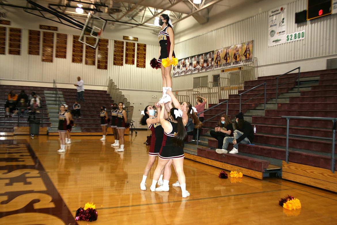 The Moses Lake High School cheerleaders perform during a unified basketball game Feb. 9 at MLHS.
