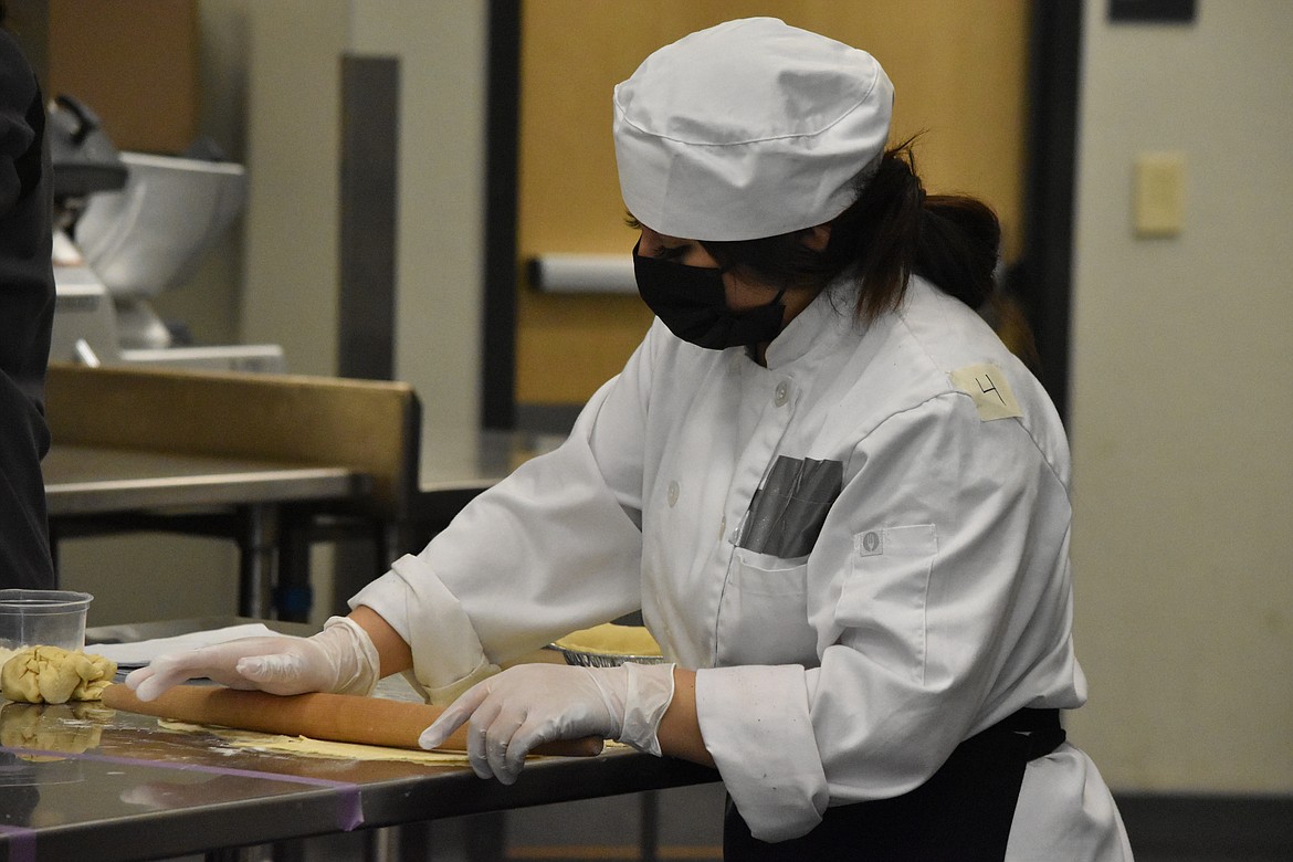 CB Tech student Isabel Duran rolls out the dough for her pie crust during Friday’s SkillsUSA regional commercial baking contest.