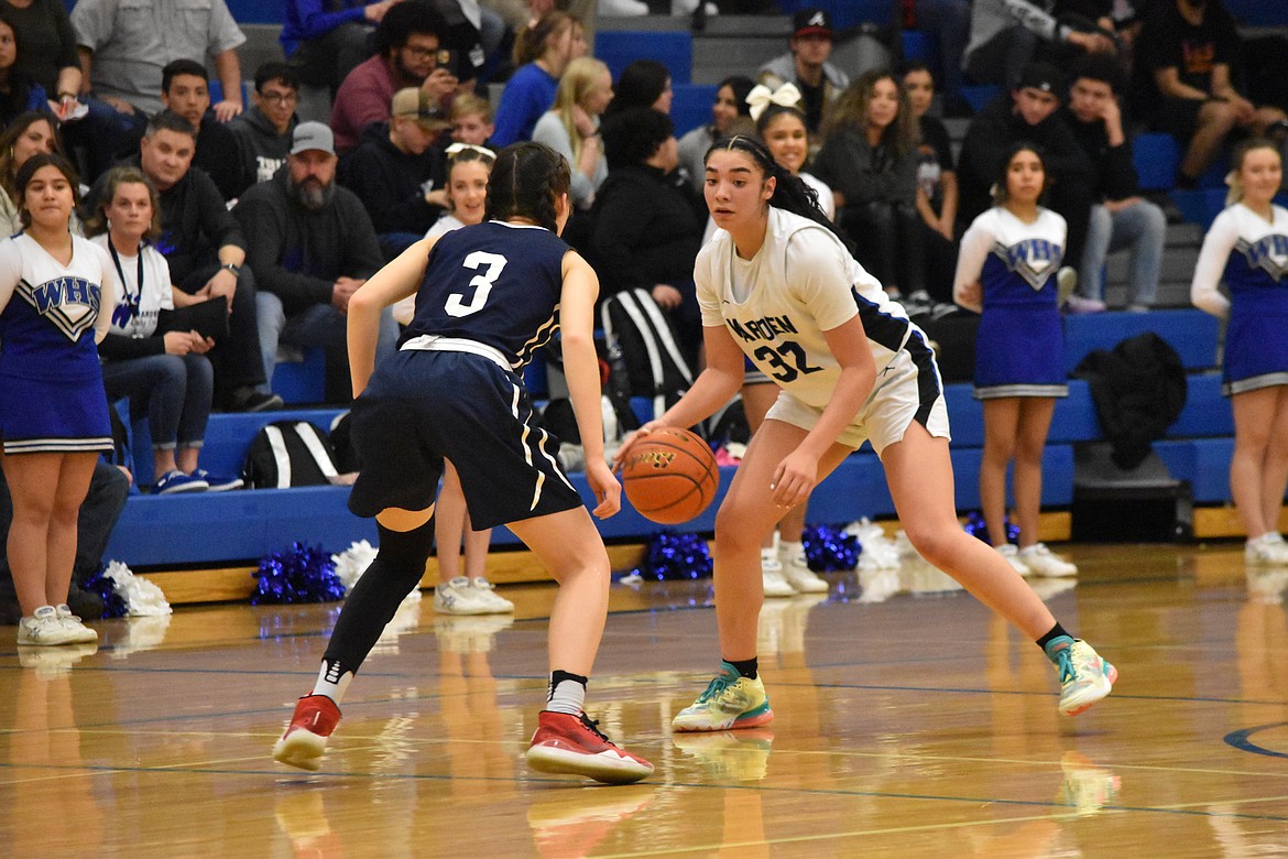 Warden High School senior Kiana Rios (32) faces Tri-Cities Prep senior Hannah Chang (3) during the district matchup on Feb. 12 at Warden High School.