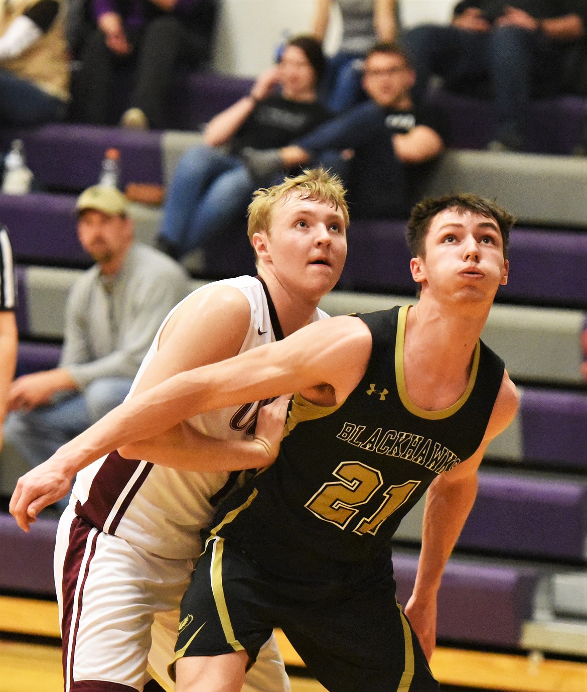 Charlo junior Stetson Reum battles Seeley-Swan's Owen Hoag for a rebound. (Scot Heisel/Lake County Leader)