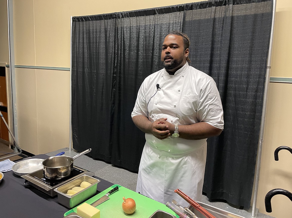 Chef RJ Harvey, culinary director for Potatoes USA, prepares to show how best to dice a potato and peel an onion to make French Onion Potato Casserole during the annual Washington Oregon Potato Conference in Kennewick last week.