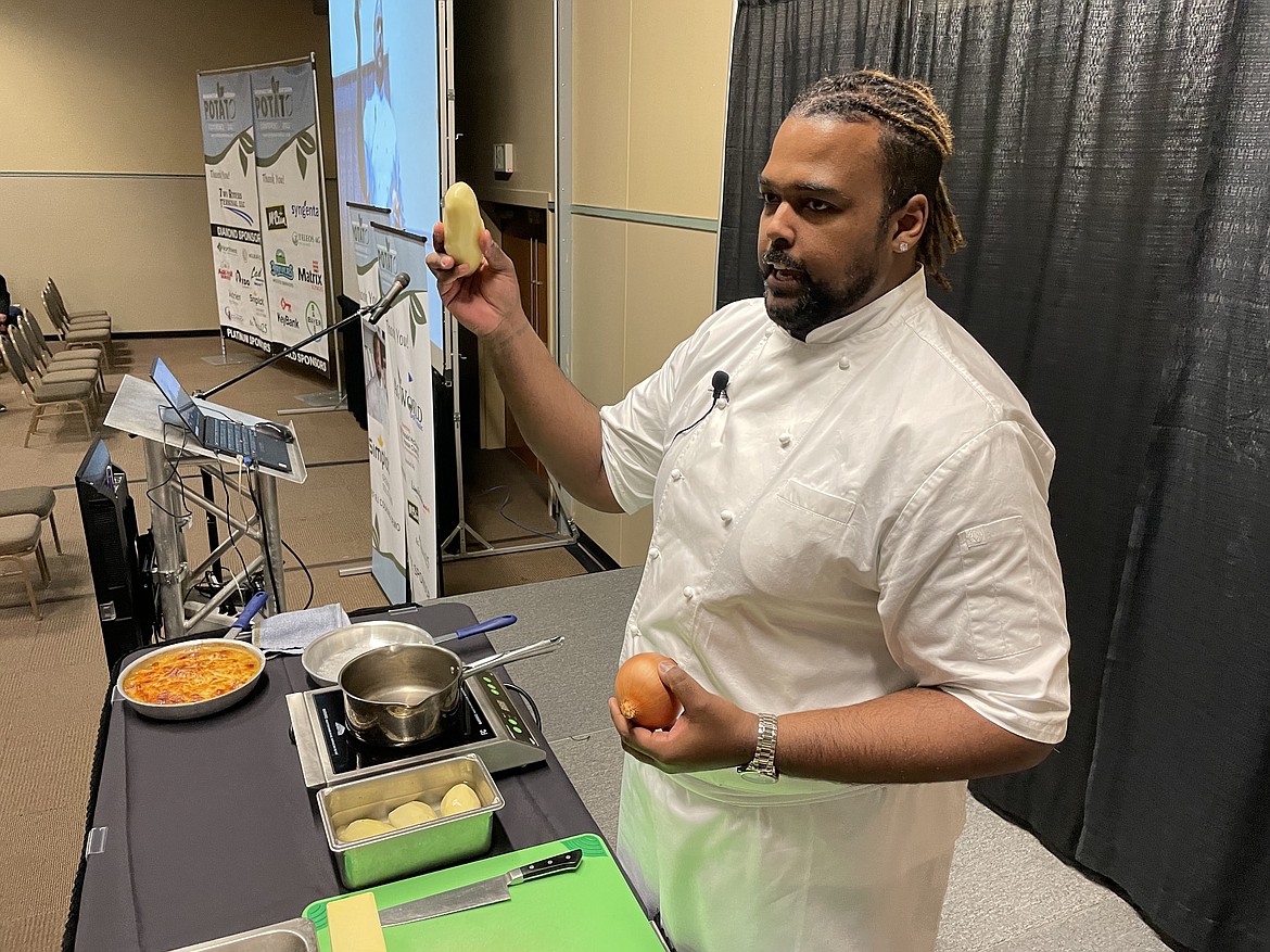 Chef RJ Harvey, culinary director for Potatoes USA, prepares to show how best to dice a potato and peel an onion to make French Onion Potato Casserole during the annual Washington Oregon Potato Conference in Kennewick last week.