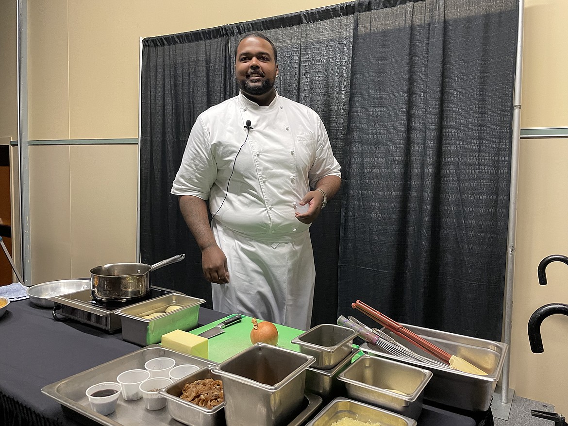 Chef RJ Harvey, culinary director for Potatoes USA, prepares to show how best to dice a potato and peel an onion to make French Onion Potato Casserole during the annual Washington Oregon Potato Conference in Kennewick last week.