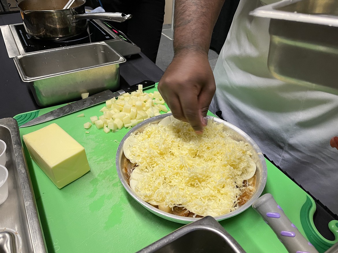 Chef RJ Harvey dicing a potato.