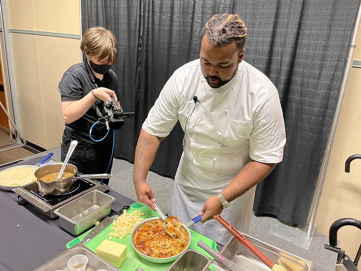 Chef RJ Harvey, culinary director for Potatoes USA, dishes up some French Onion Potato Casserole during the annual Washington Oregon Potato Conference in Kennewick last week.