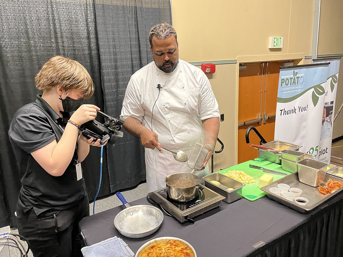 Chef RJ Harvey, culinary director for Potatoes USA, prepares to show how best to dice a potato and peel an onion to make French Onion Potato Casserole during the annual Washington Oregon Potato Conference in Kennewick last week.