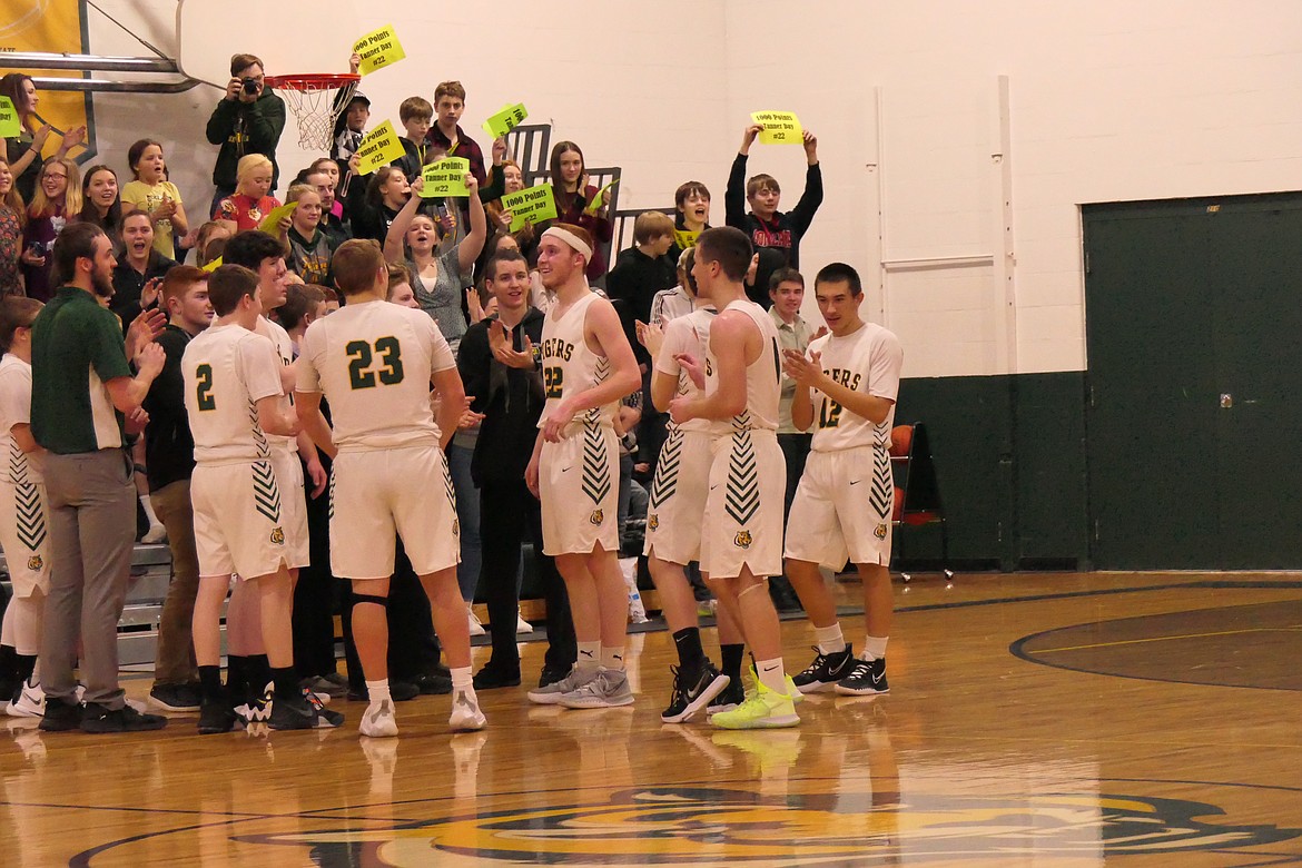 St. Regis senior forward Tanner Day gets a standing ovation from the crowd in St. Regis after scoring his 1,000 career point in the game versus Valley Christian.  (Chuck Bandel/VP-MI)