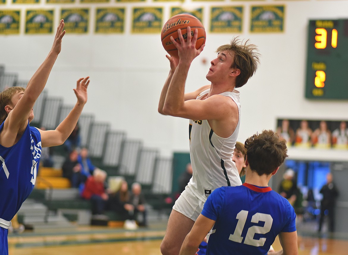 Whitefish's Bodie Smith drives in the lane against CFalls on Saturday. (Whitney England/Whitefish Pilot)