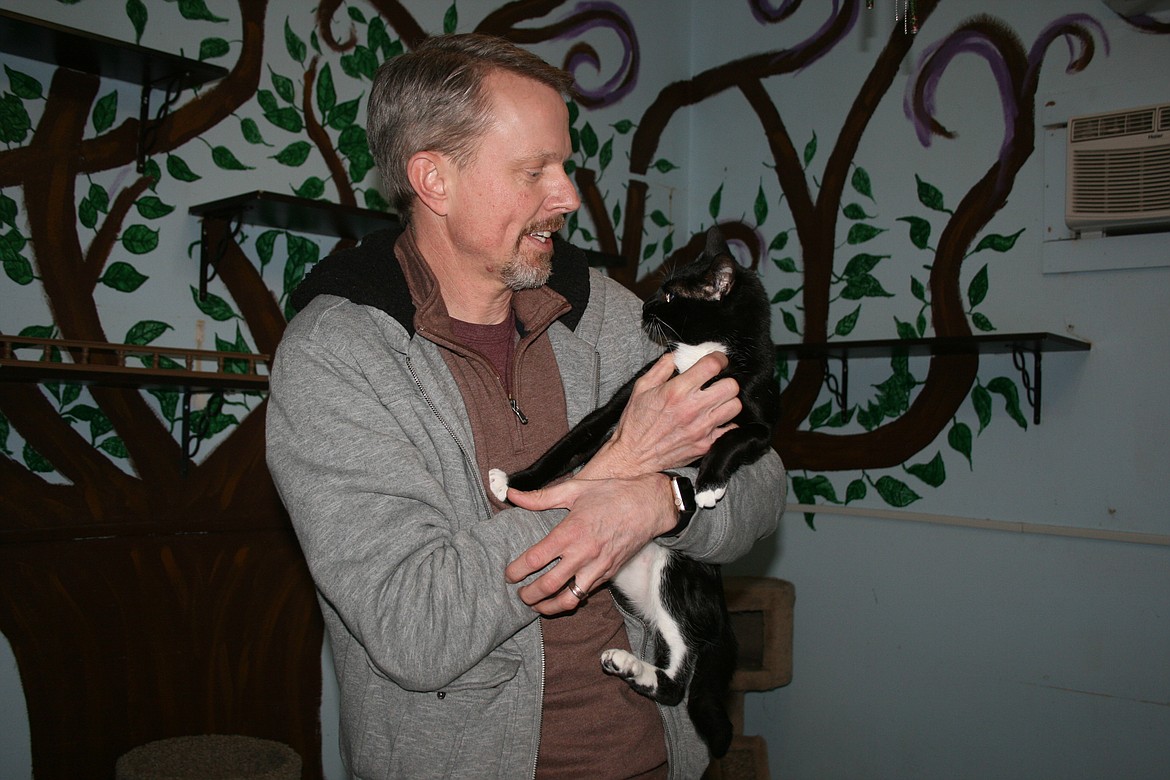 Grant County Animal Outreach director Darrin Hein with shelter cat Viola Feb. 10.