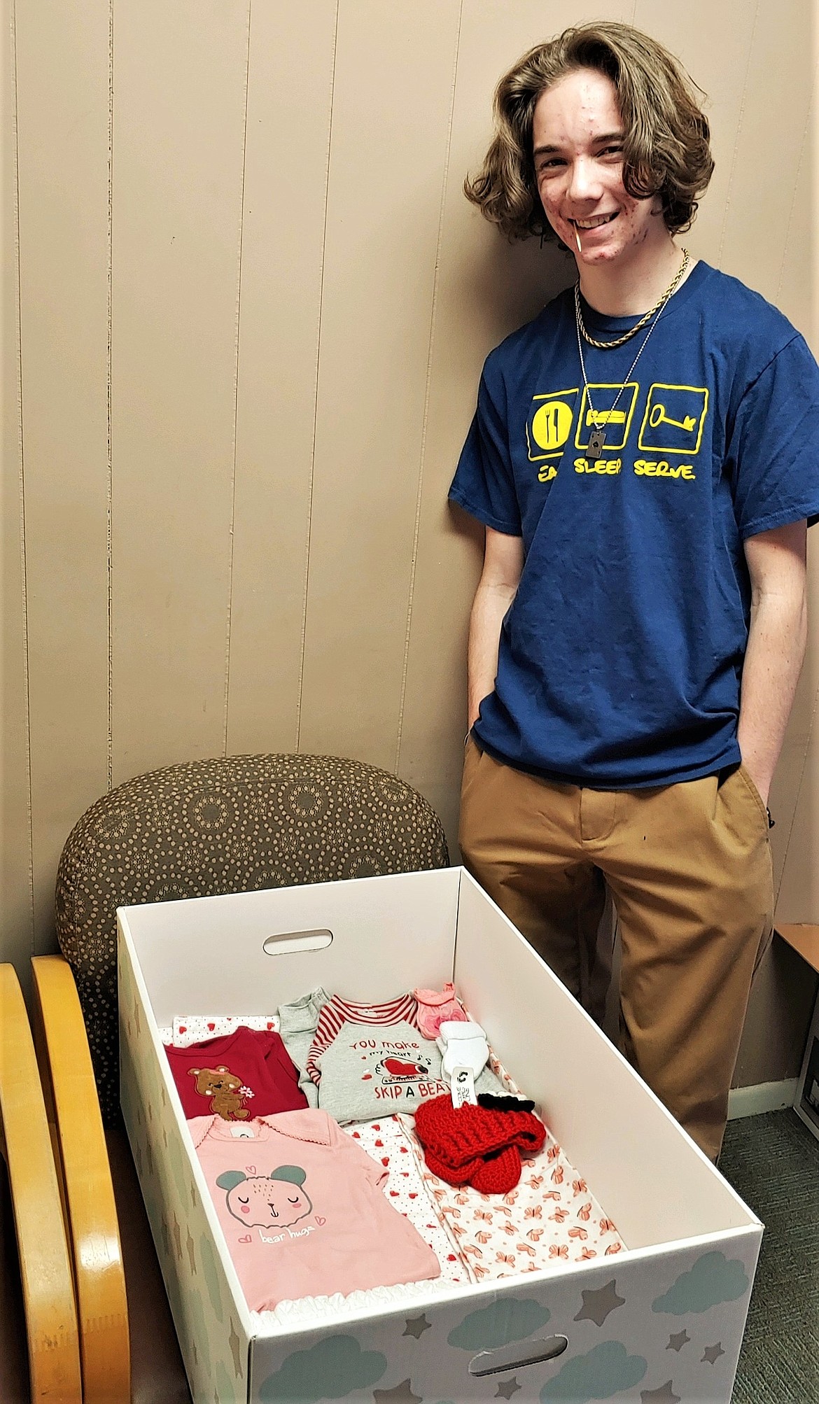 Achilles Maroney is among the Polson High School Key Club members who raised funds, then purchased and assembled bassinets and supplies for newborn babies at St. Joseph Medical Center. (Courtesy Jennifer Rolfsness)