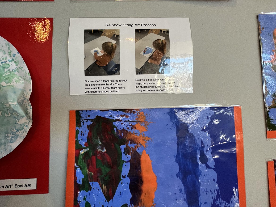 Displays included explanations of how the young artists created their work such as the one shown in the photo above. Rainbow string art projects were made using a roller to make a sky backdrop after which strings dipped in paint were drug across the canvas to create a rainbow effect.