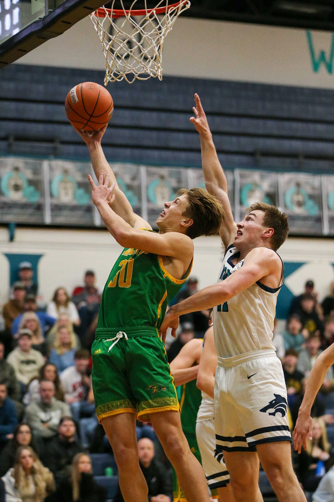 JASON DUCHOW PHOTOGRAPHY
Caysen Loutzenhiser of Lakeland goes up for a layup as Zach Johnson of Lake City defends Tuesday night at Lake City.