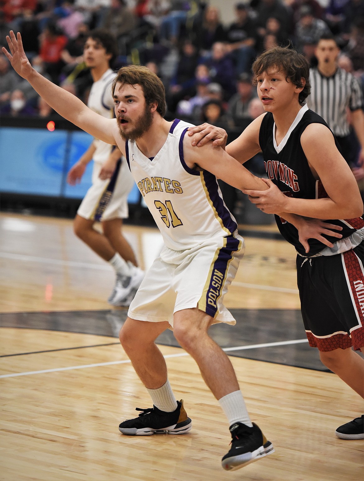 Polson senior Ethan McCauley posts up against Browning's Delbert Blackman. (Scot Heisel/Lake County Leader)