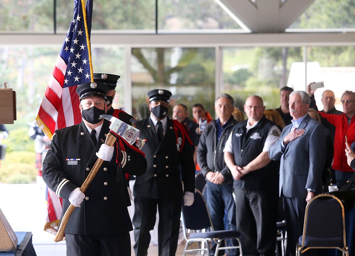 Coeur d'Alene Fire Department inspector Craig Etherton leads the opening ceremony at the retirement party for CDA Fire Chief Kenny Gabriel on Tuesday.