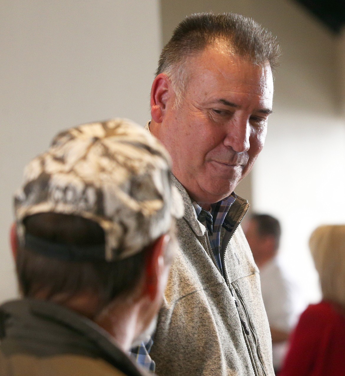 Kenny Gabriel pauses as he visits with a guest at his retirement party on Tuesday.