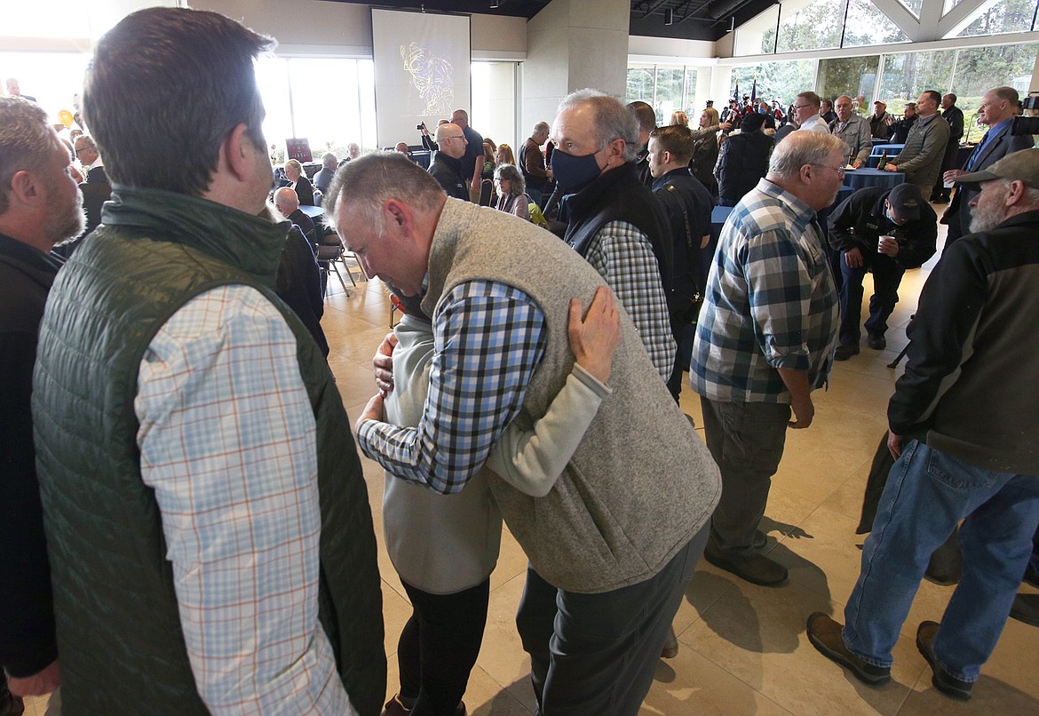 Mary Duff gives Kenny Gabriel a hug at his retirement celebration on Tuesday at the Hagadone Event Center.