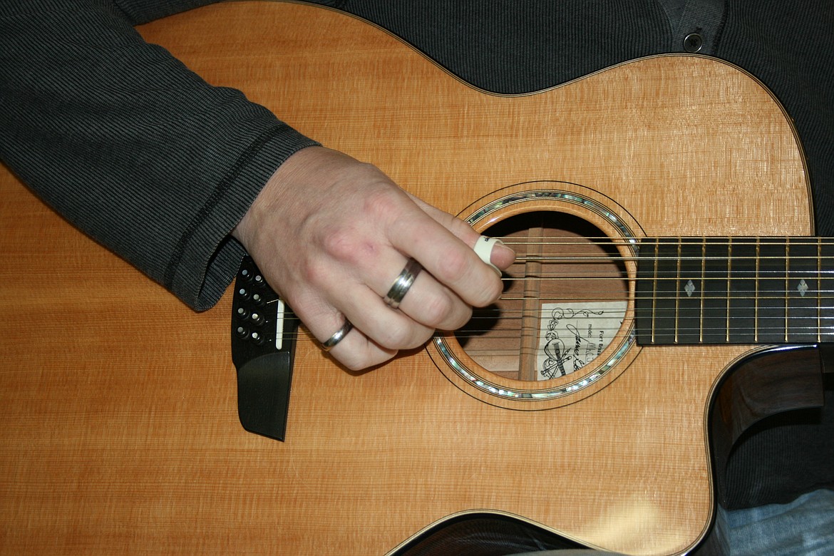 Adam Cord shows his skill on guitar Feb. 12 before a concert in Moses Lake.