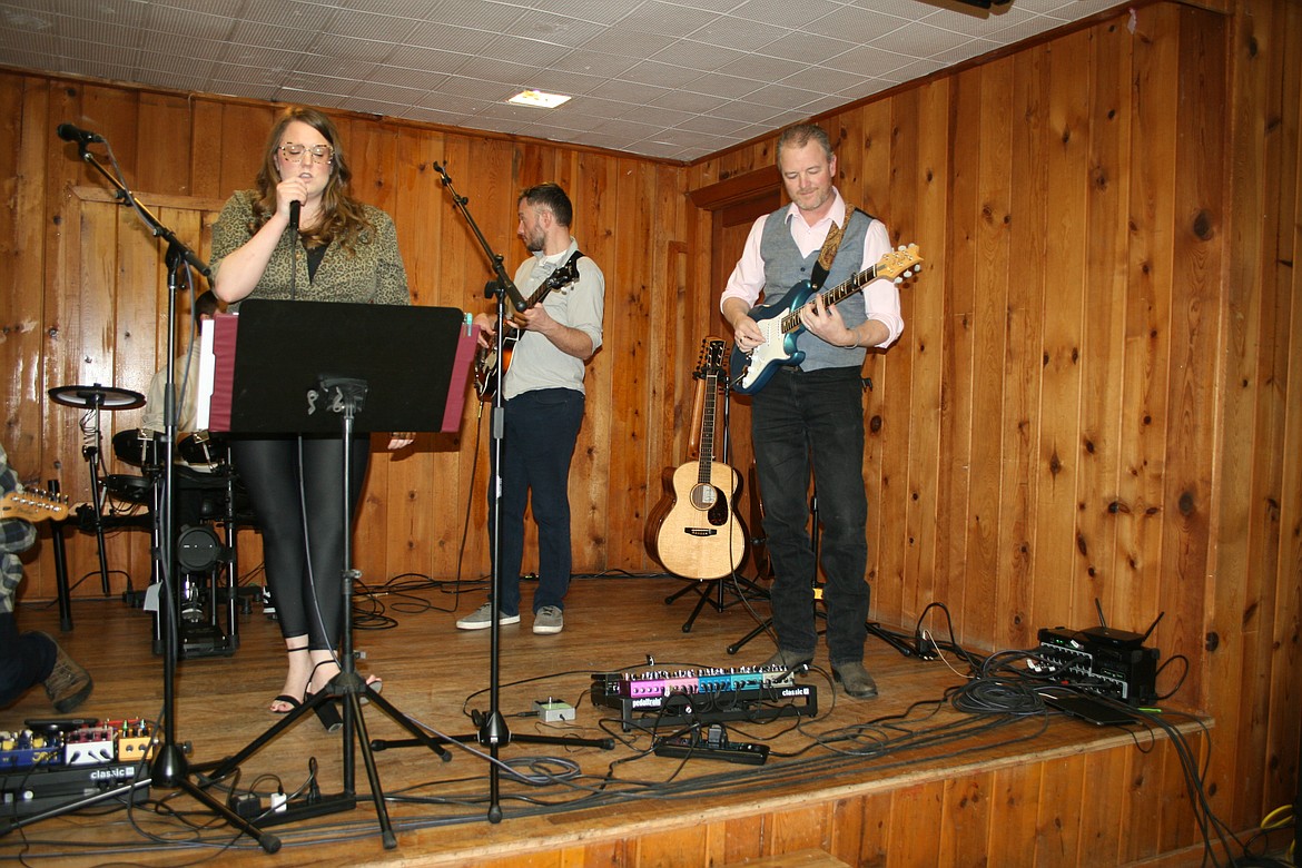 (From left) Vocalist Alisha Liedtke and bass player Drew Liedtke of the band Some Other People and guest Adam Cord do a sound check before a concert Feb. 12 in Moses Lake.