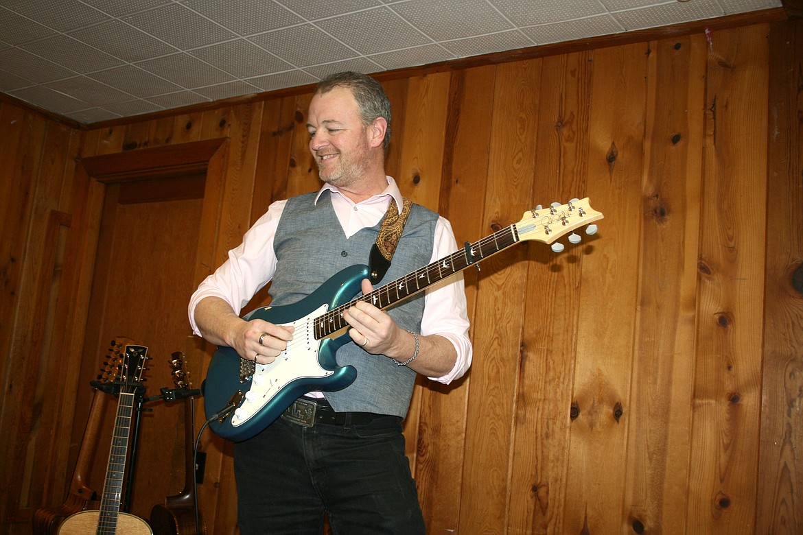 Guitarist Adam Cord warms up before a Moses Lake concert Feb. 12.