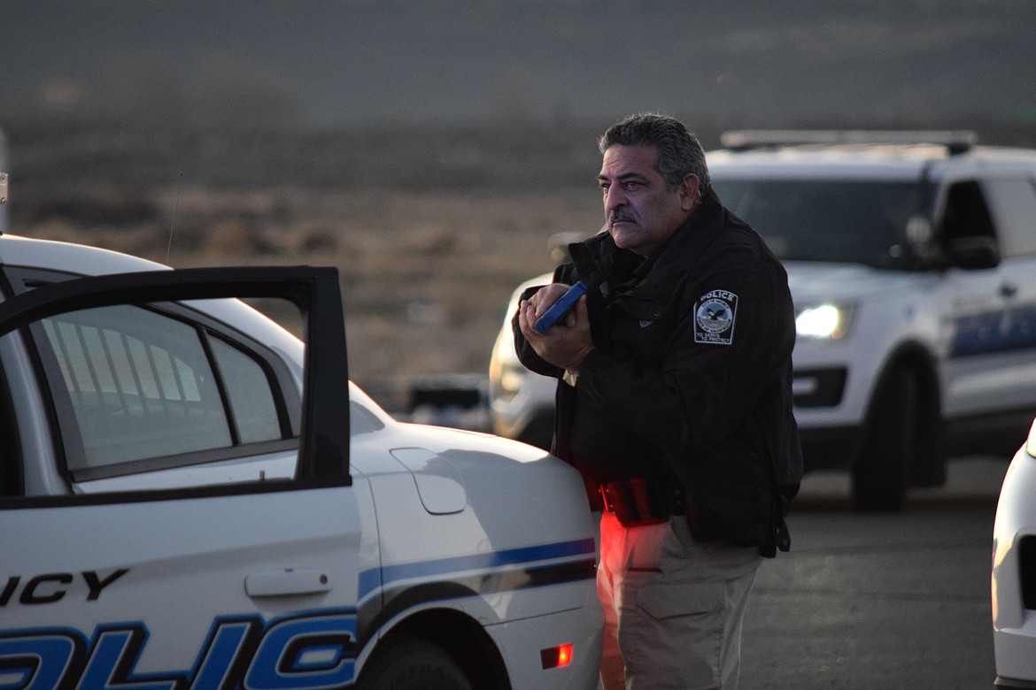 Quincy Police Officer Sal Mancini stands alert during a simulated high-risk stop. This exercise and others help police hone skills in a safe environment that doesn’t place the public at risk.