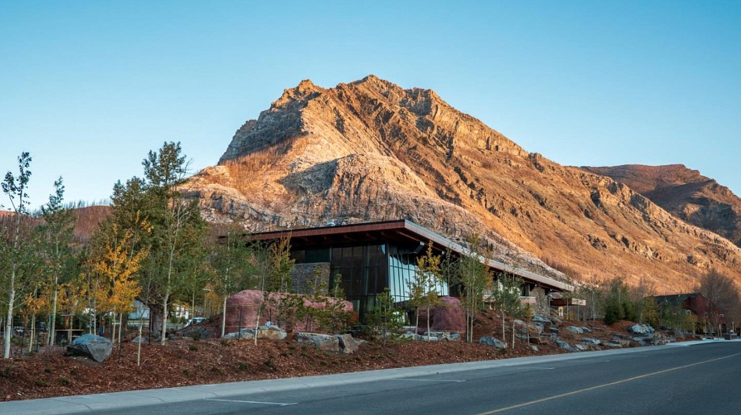 Parks Canada’s new Waterton Lakes Visitor center, with morning sunshine on Crandell Mountain. (Parks Canada photo)