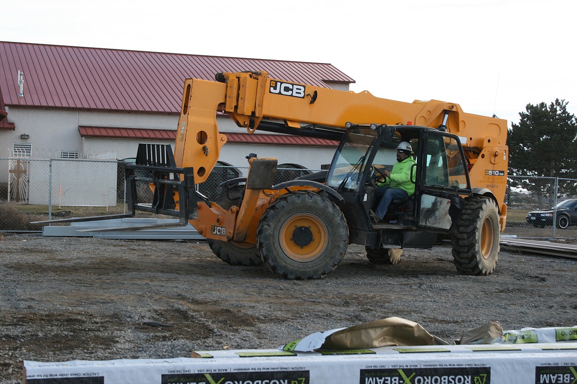 A construction worker at the site of the Fatima Center at Our Lady of Fatima Catholic Church in Moses Lake. Jobs in the construction industry remained strong in 2021.